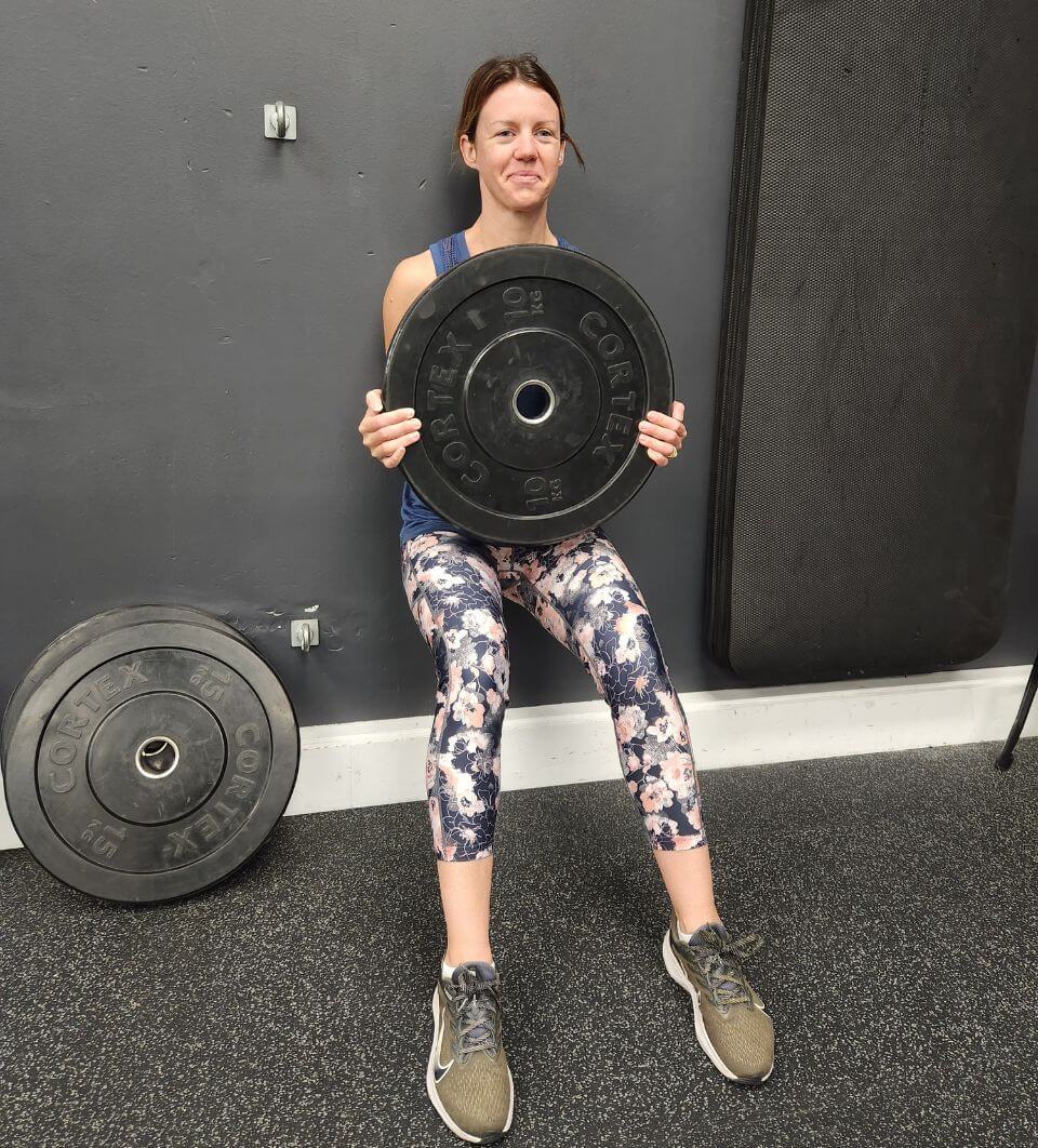 Woman doing Wall Squats | Featured Image for the Move & Mobility Landing Page for Above and Beyond Fitness Hub